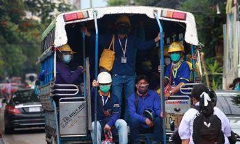 Construction workers are transported by “Songthaew” in the Bon Kai area in Bangkok. Photo: Apichart Jinakul